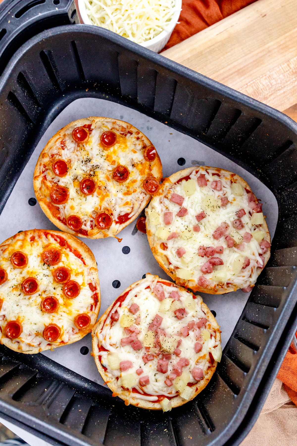 Top view of fried Air Fryer Pizza Bagels in an air fryer.