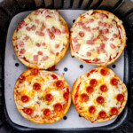 Top view of fried Air Fryer Pizza Bagels in an air fryer.