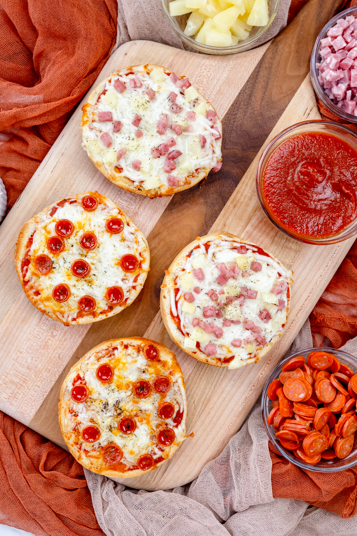 Top view of Air Fryer Pizza Bagels on a wooden surface.