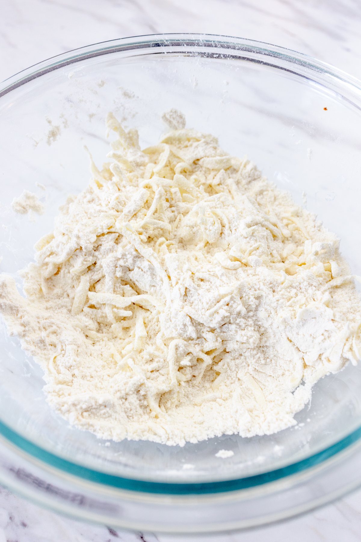 Top view of ingredients in a glass mixing bowl.