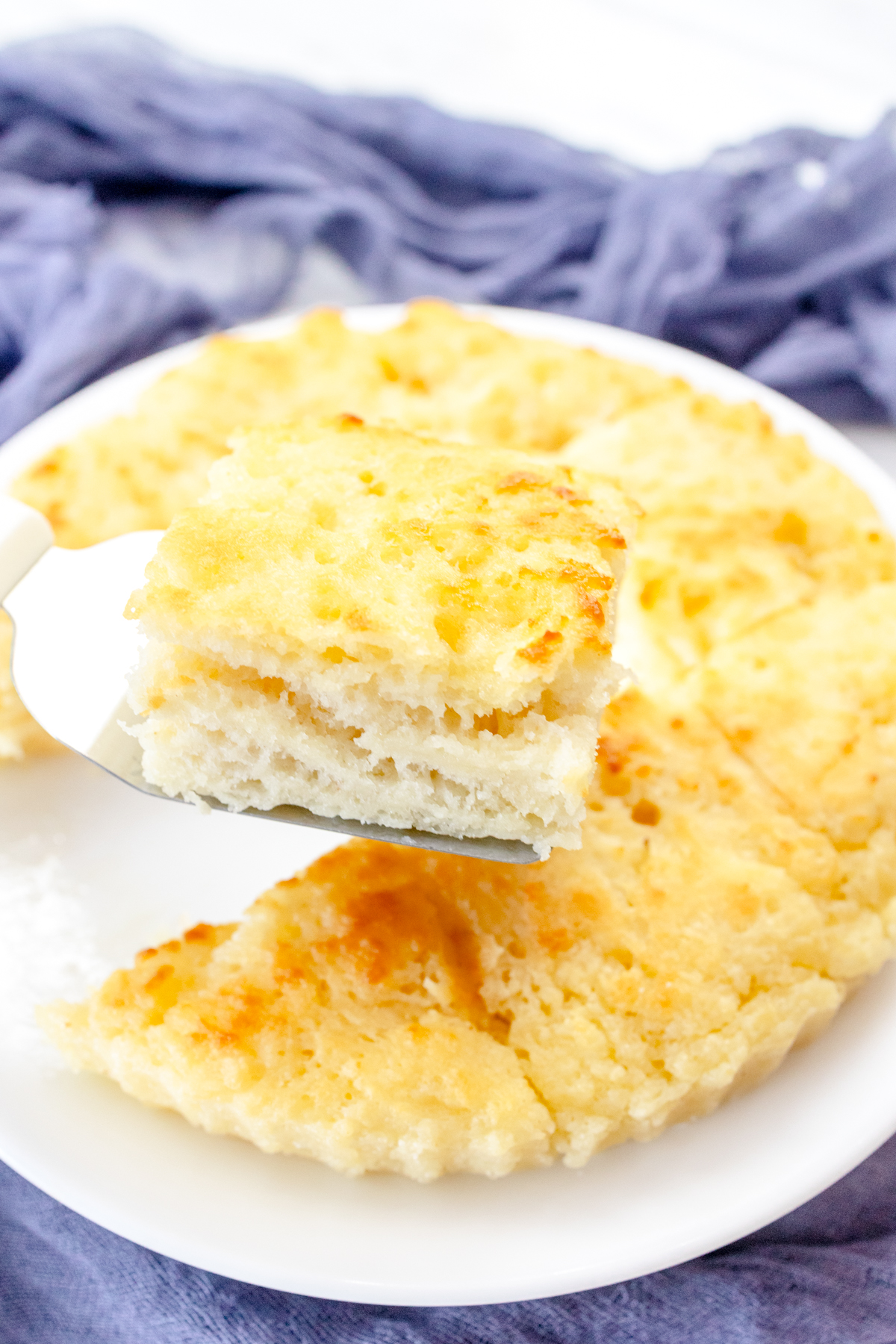 Medium-close shot of swim biscuits on a white plate.