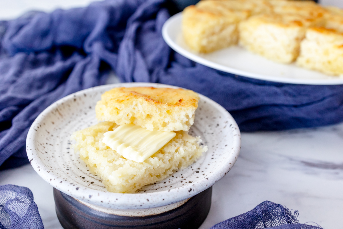 Medium-close shot of butter swim biscuits on white plates.