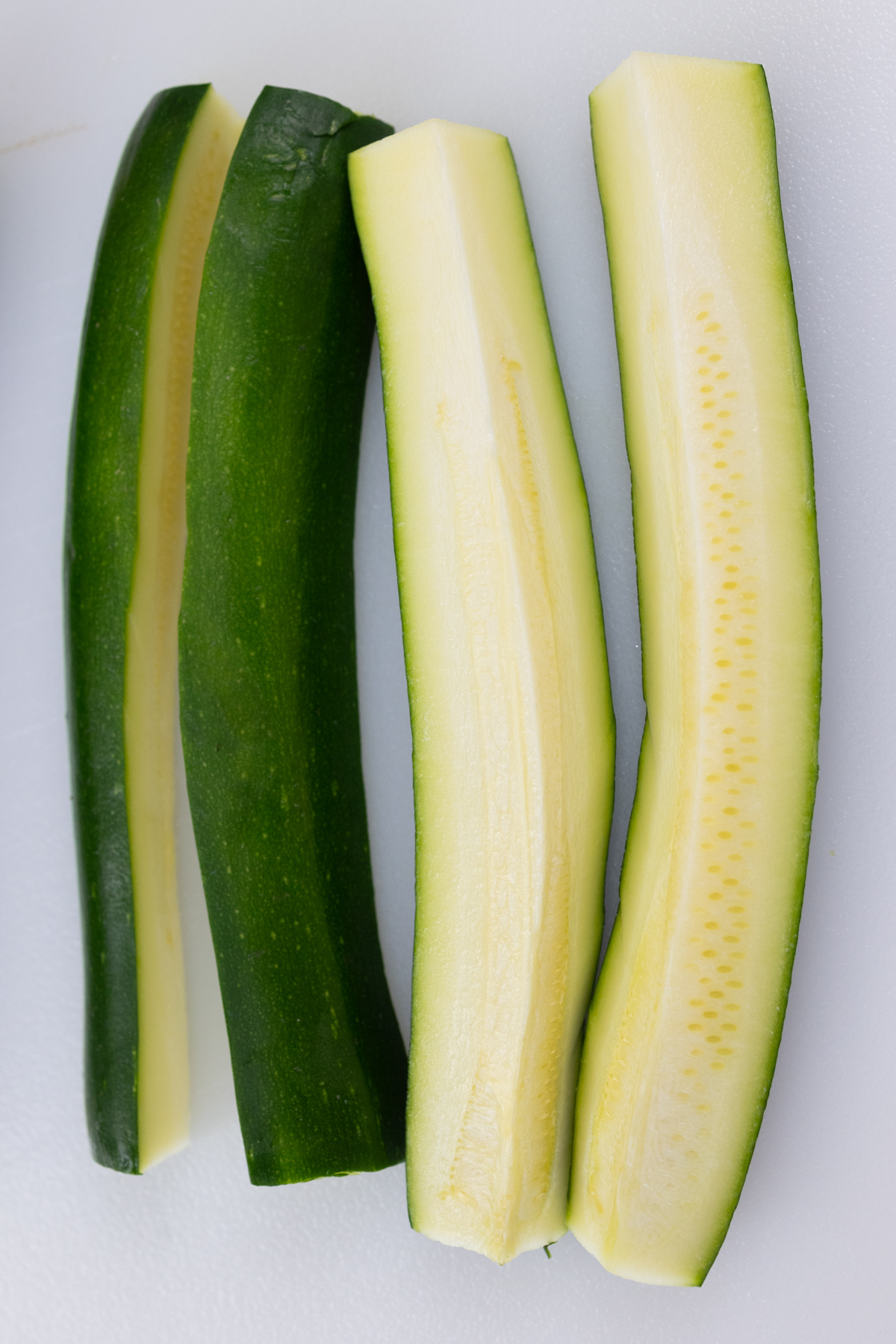 Zucchini sliced in quarters lengthways.