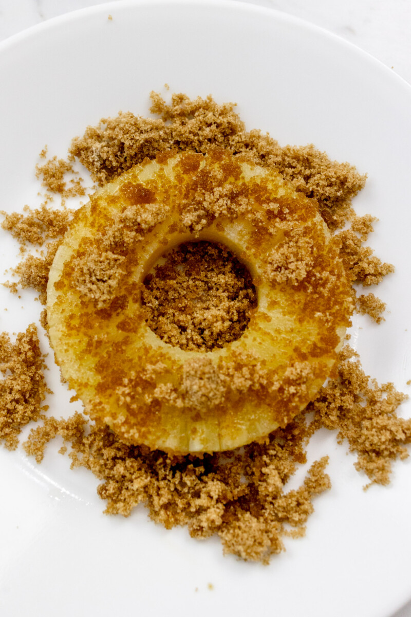 Dipping Pineapple in Brown Sugar for Pineapple Cakes