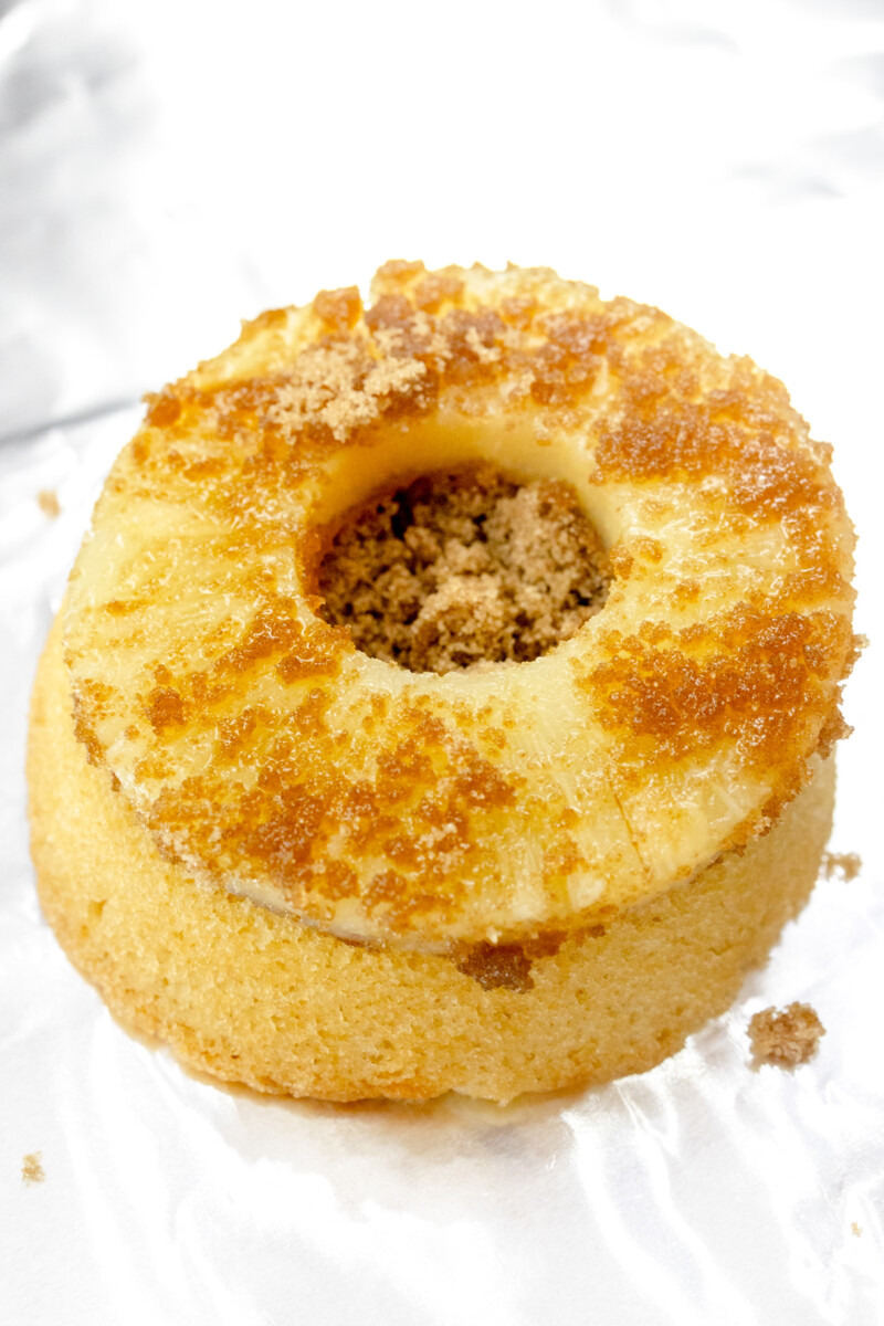 Pineapple Ring Coated in Brown Sugar on top of Sponge Cake