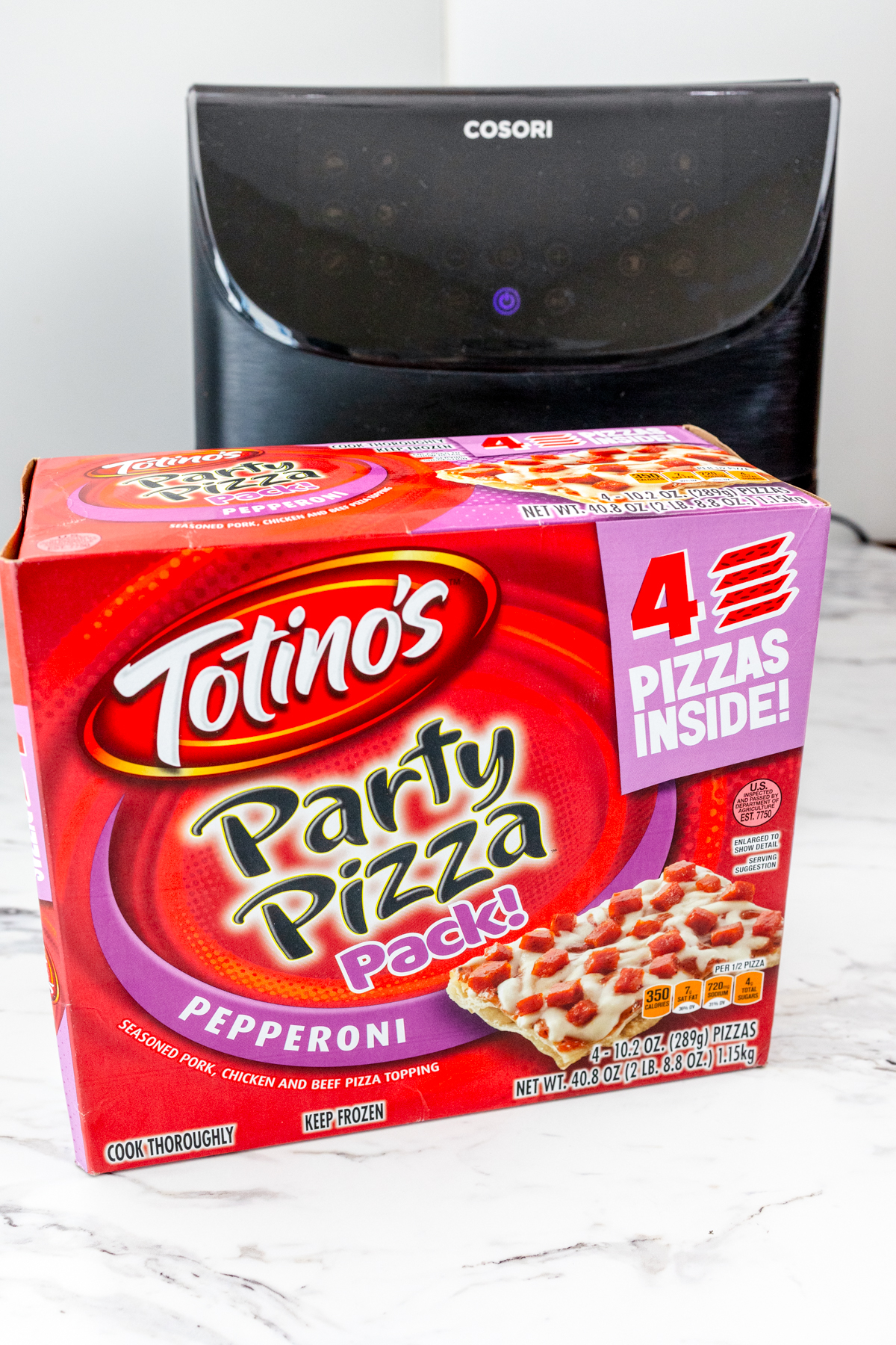 Totino's party pizza box in front of an air fryer.